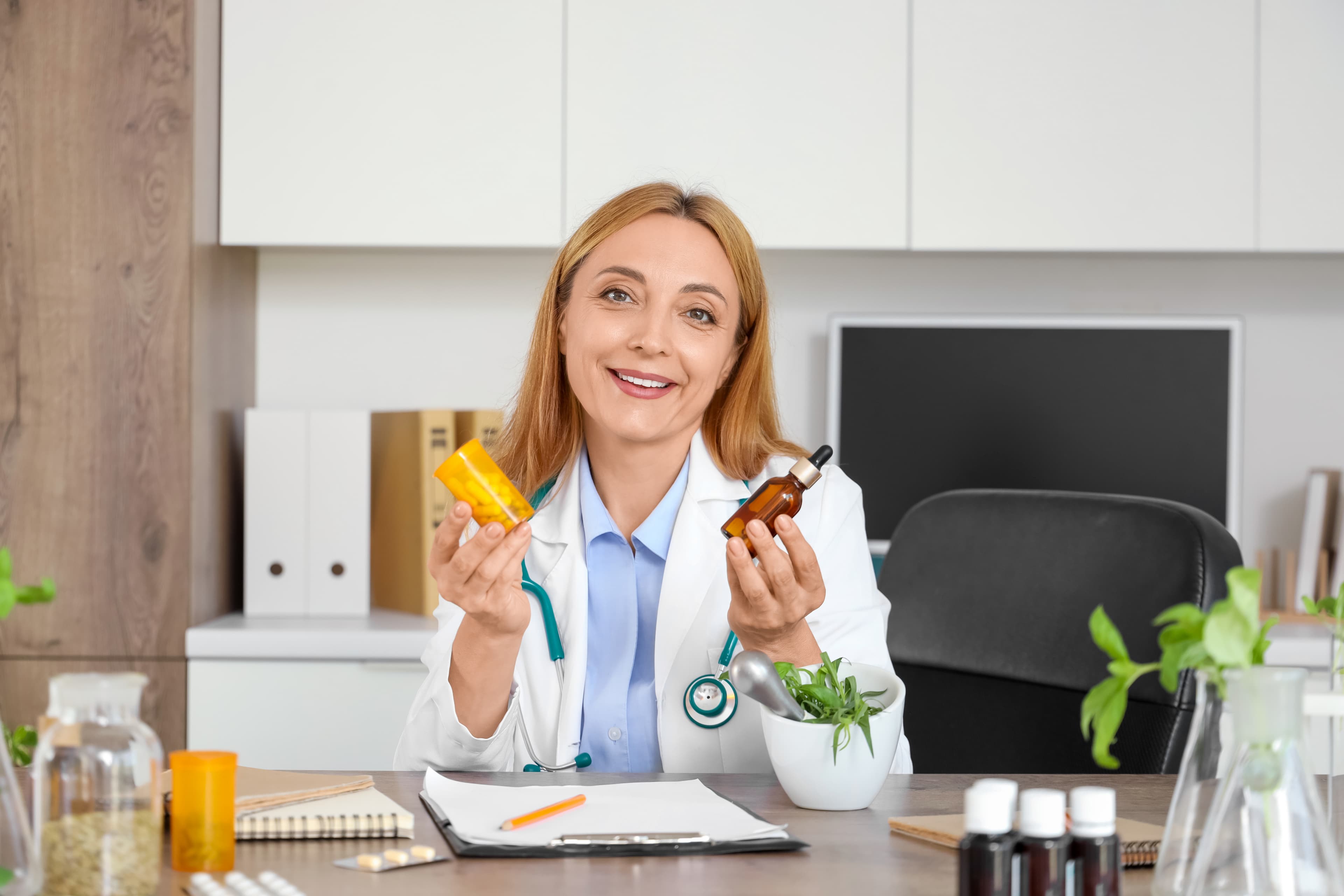 Practitioner consulting with a client about herbal protocols