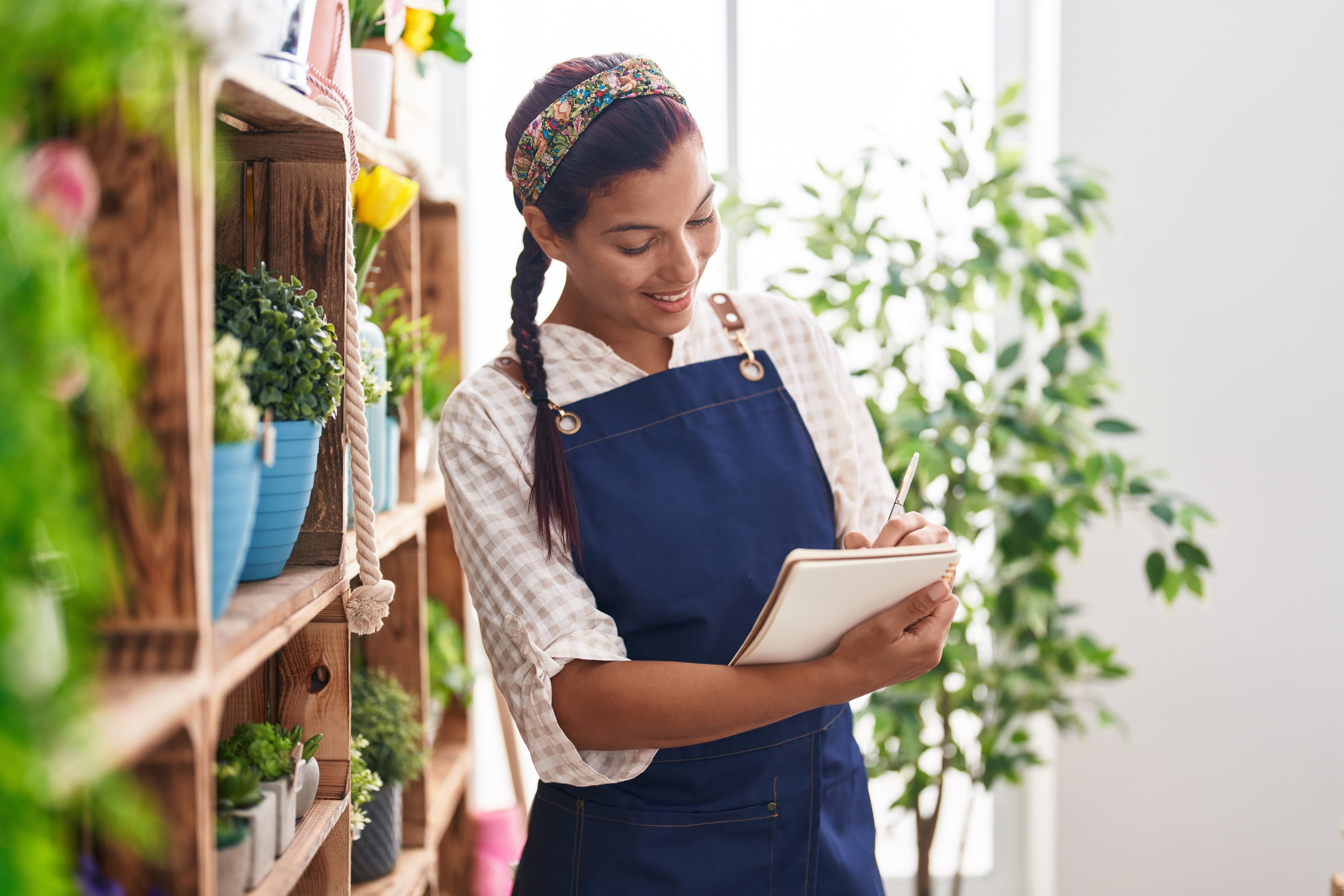 Herbalist at work at a warm apothecary shelf